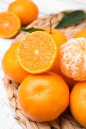 Photo of Fresh juicy tangerines on white wooden table, closeup