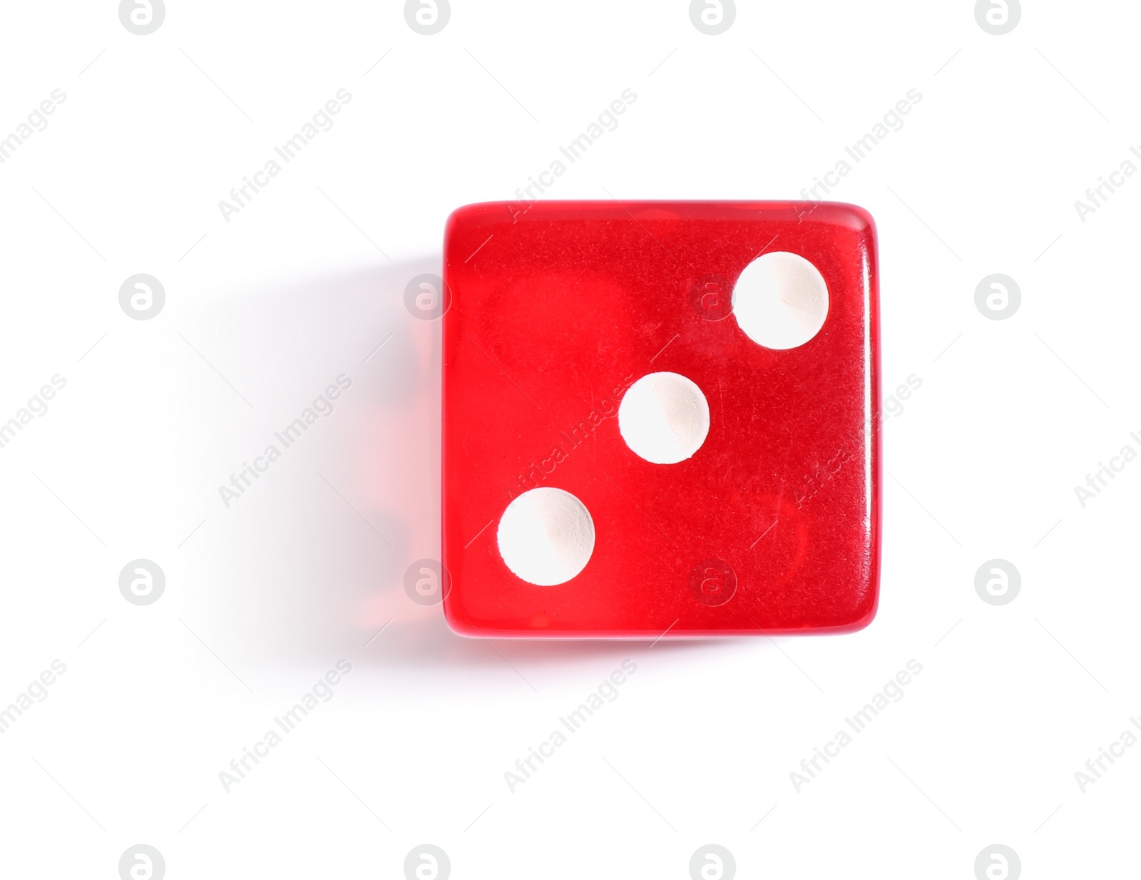 Photo of One red game dice isolated on white, top view