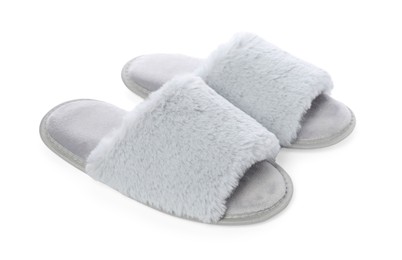 Photo of Pair of soft slippers with fur isolated on white