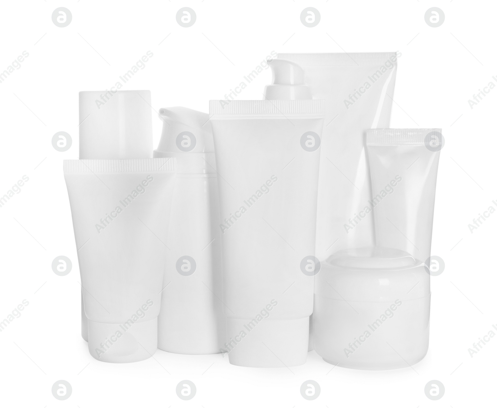 Photo of Blank tubes and jars of cosmetic products on white background