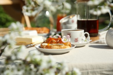 Photo of Beautiful table setting in spring garden on sunny day