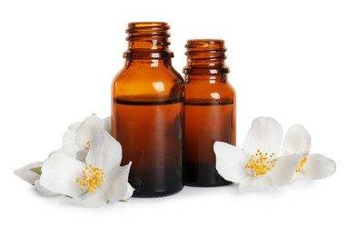 Photo of Jasmine essential oil and fresh flowers on white background