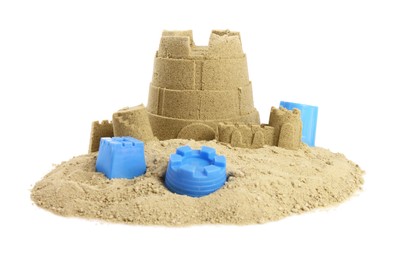 Photo of Pile of sand with beautiful castle and plastic beach toys isolated on white