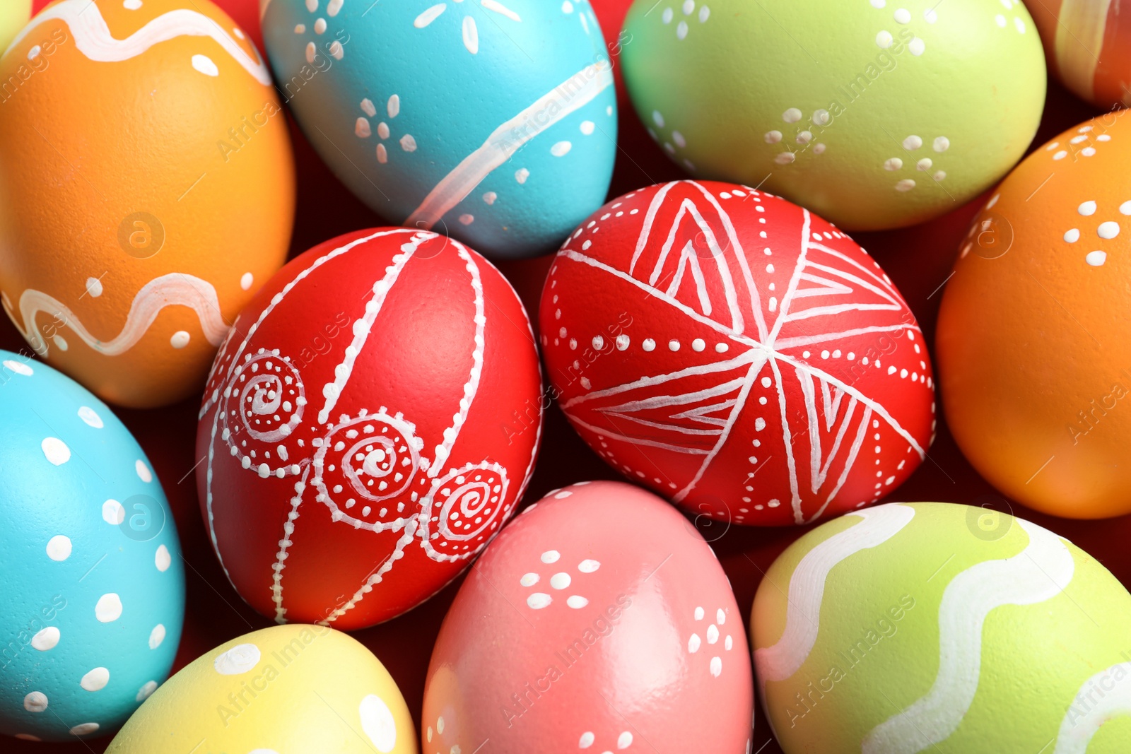 Photo of Colorful decorated Easter eggs as background, top view