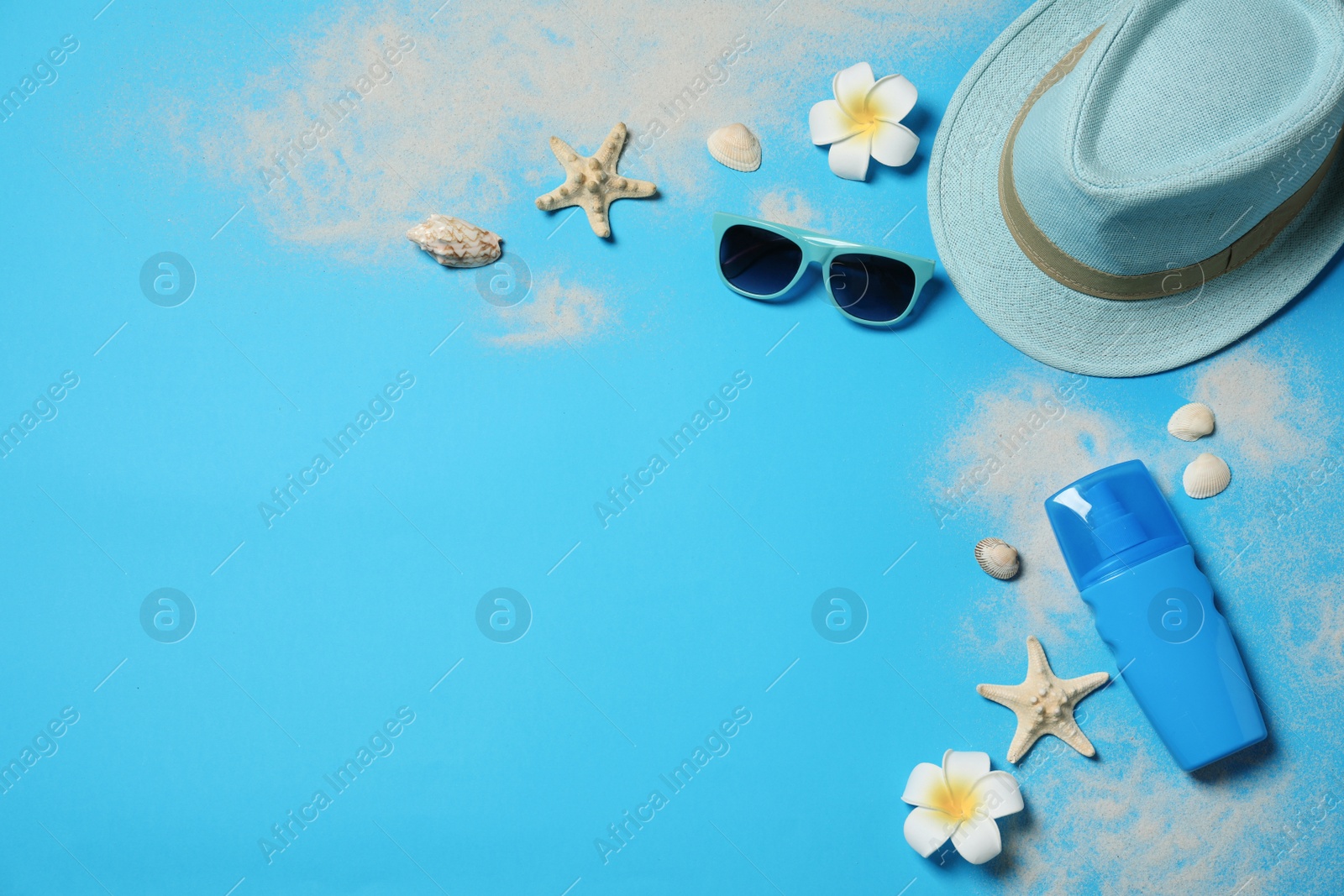 Photo of Flat lay composition with beach accessories on color background, space for text