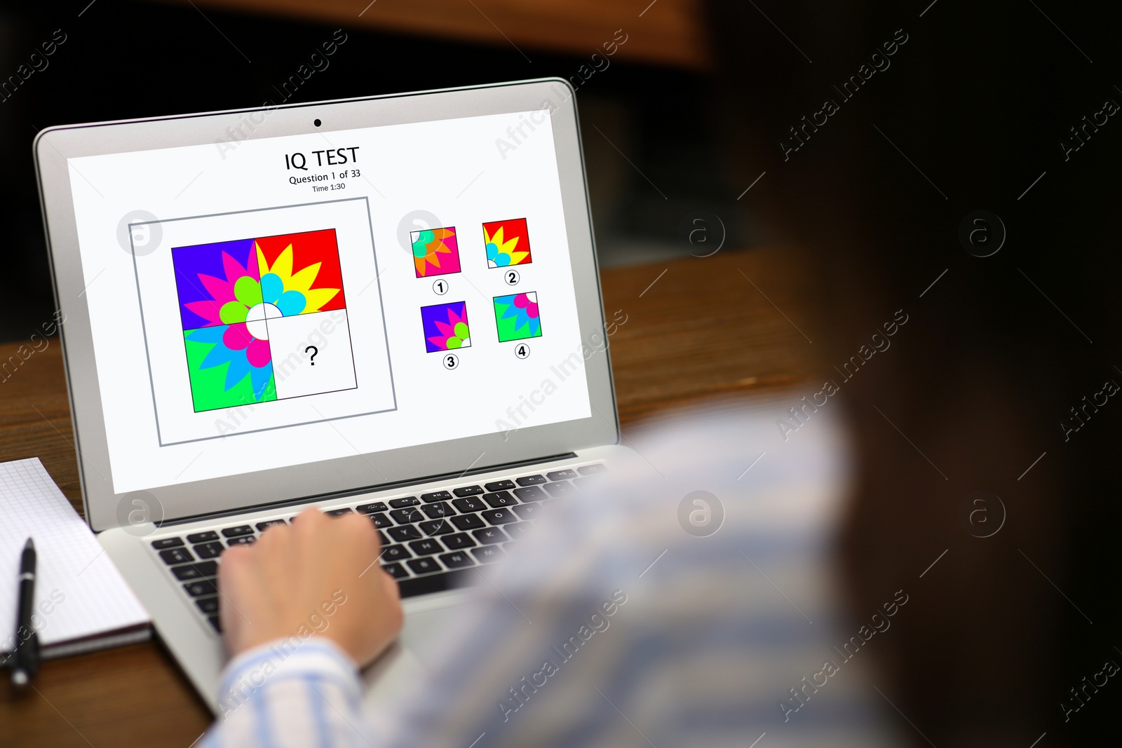 Image of Woman using laptop for taking IQ test indoors, closeup