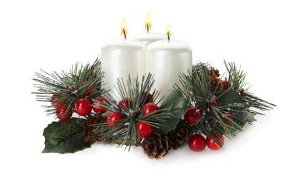 Photo of Burning candles with Christmas decor isolated on white