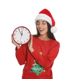 Photo of Woman in Santa hat with clock on white background. New Year countdown