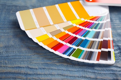 Photo of Color palette samples on wooden background