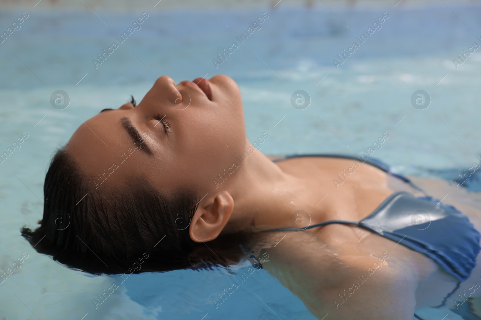 Photo of Beautiful woman relaxing in spa swimming pool