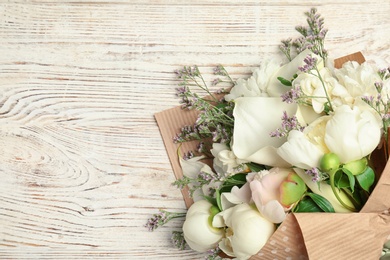 Bouquet of beautiful fragrant flowers on wooden background