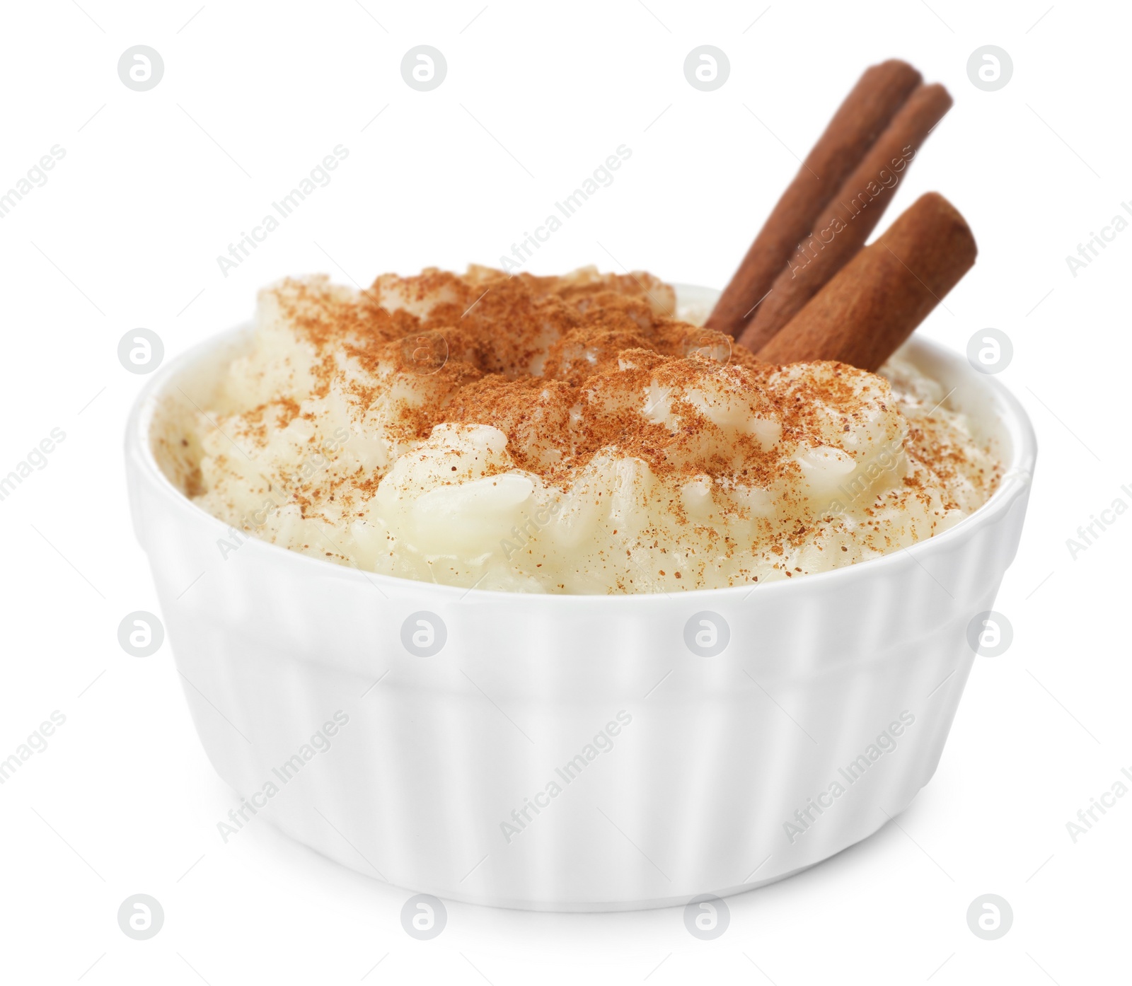 Photo of Delicious rice pudding with cinnamon isolated on white