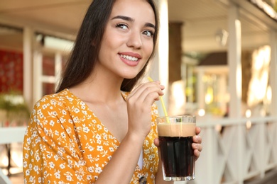 Photo of Beautiful woman with cold kvass outdoors. Traditional Russian summer drink