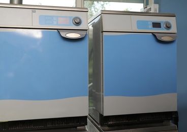 Pair of industrial machines in modern dry-cleaning