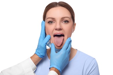 Doctor examining woman`s oral cavity on white background