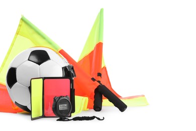 Photo of Football referee equipment. Soccer ball, flags, stopwatch, cards and whistle isolated on white