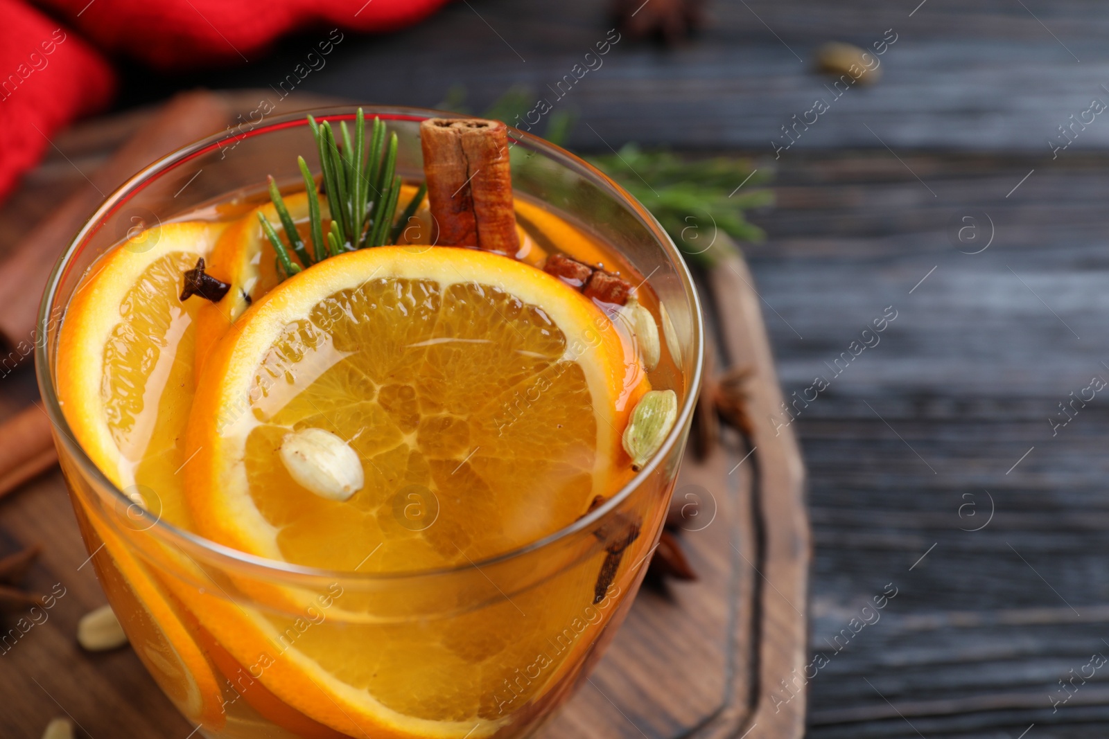 Photo of Delicious aromatic mulled wine on table, closeup