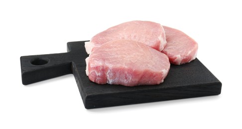 Photo of Black wooden board with pieces of raw pork meat isolated on white