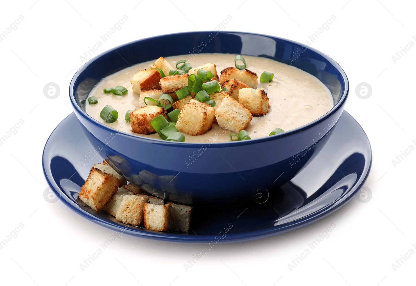 Photo of Bowl of fresh homemade mushroom soup on white background