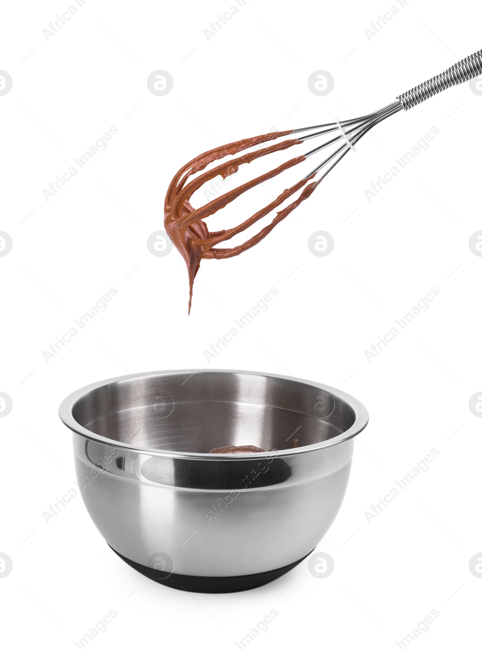 Photo of Chocolate cream flowing from whisk into bowl isolated on white