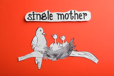Photo of Being single mother concept. Bird with babies made of paper on red background, flat lay