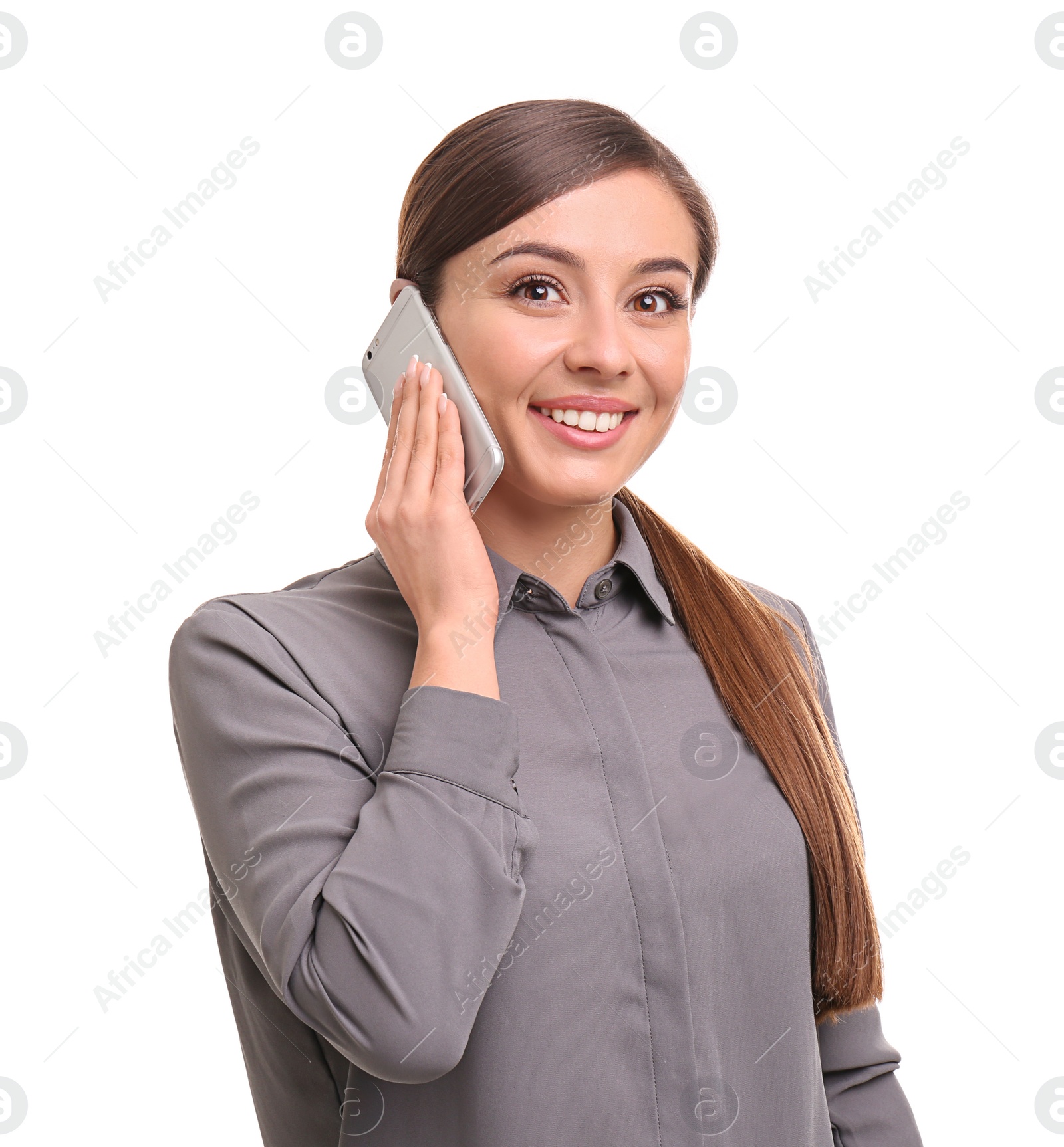 Photo of Young woman talking on phone against white background