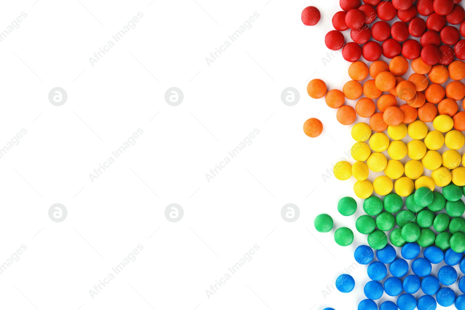 Photo of Tasty colorful candies on white background, top view