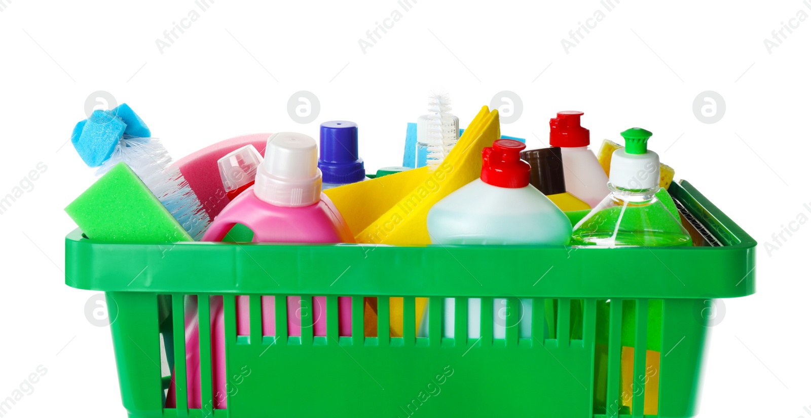 Photo of Green shopping basket with different household chemicals on white background