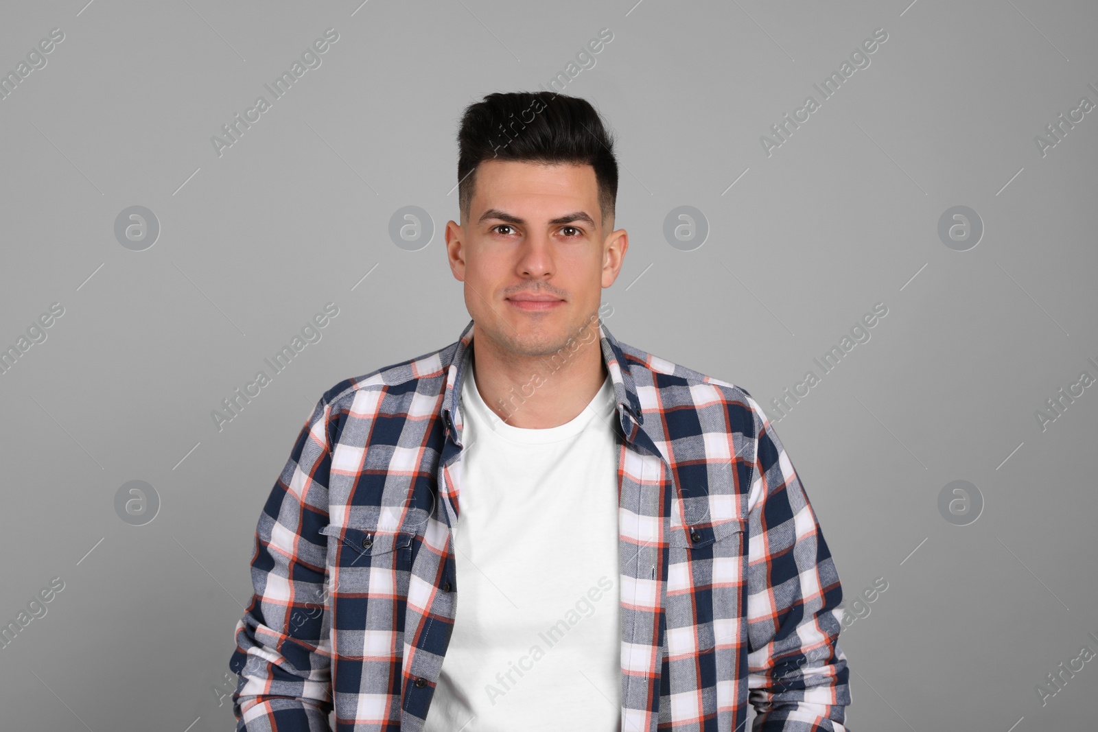 Photo of Portrait of man on light grey background. Personality concept
