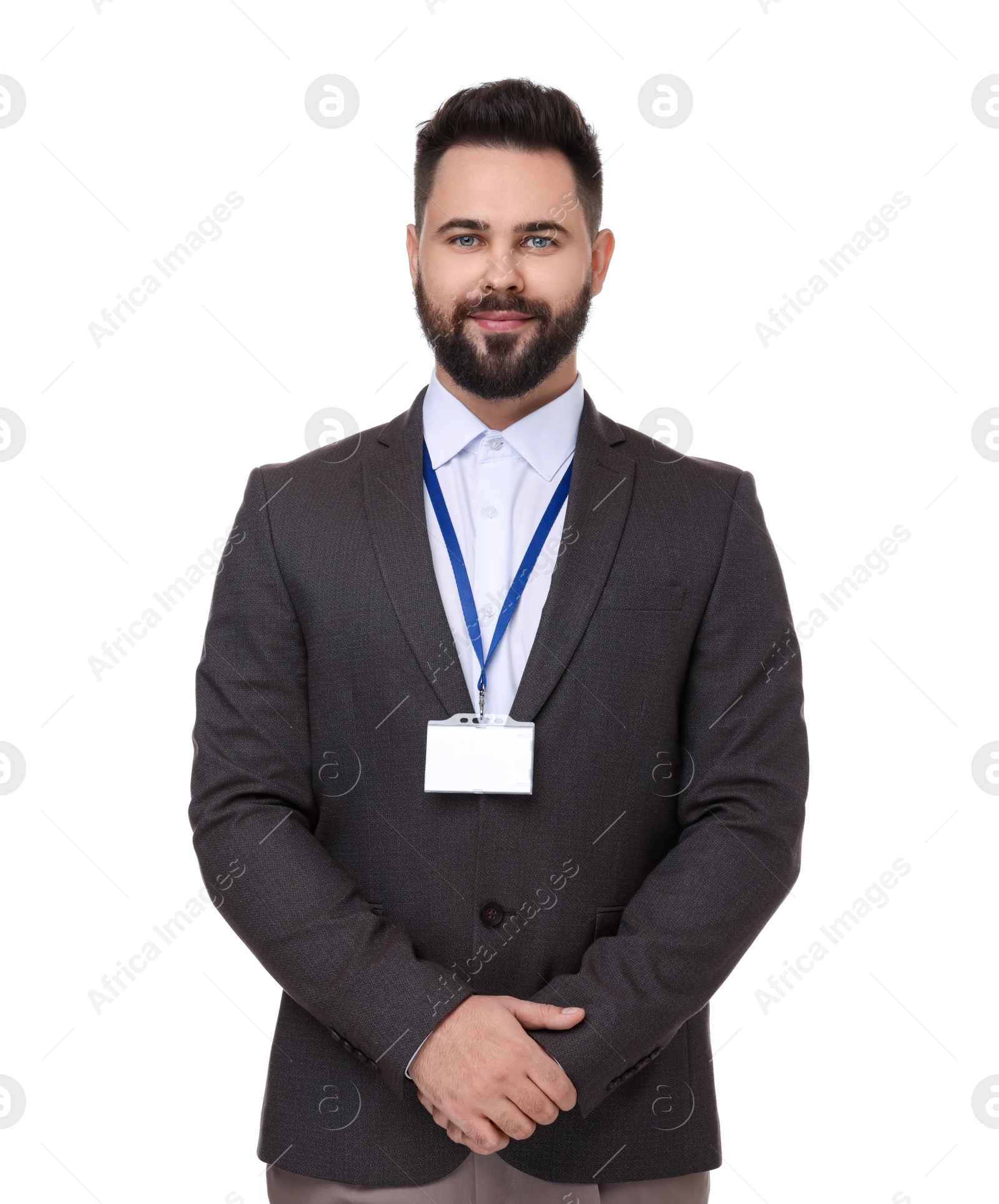 Photo of Young man with blank badge isolated on white