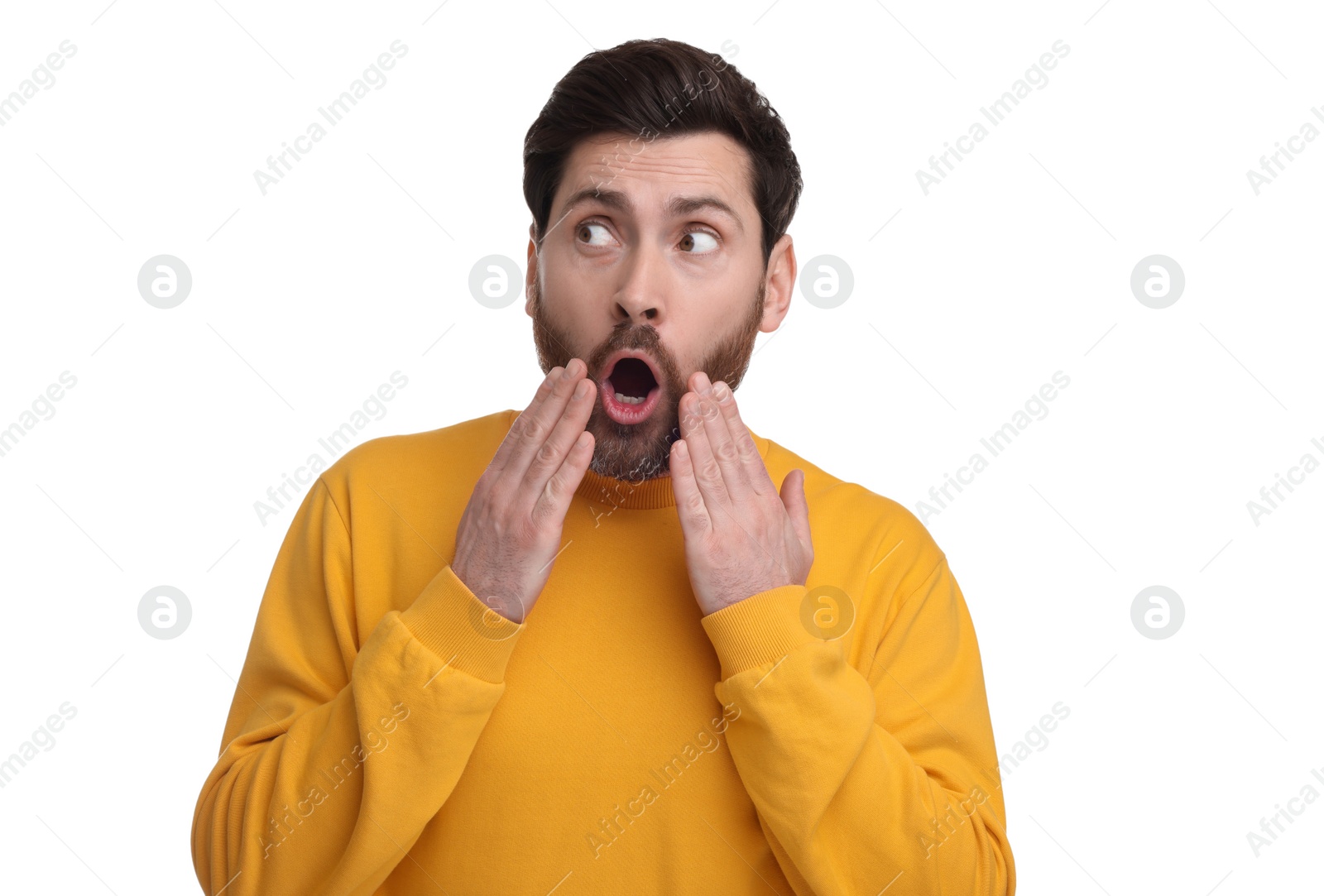 Photo of Portrait of surprised man isolated on white
