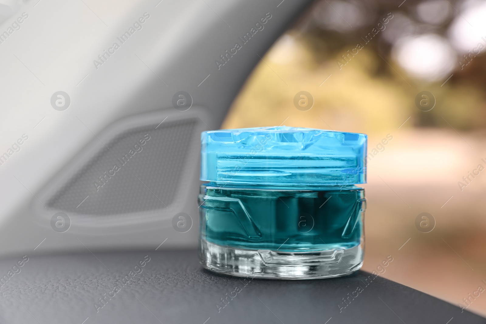 Photo of Stylish air freshener inside of car, closeup