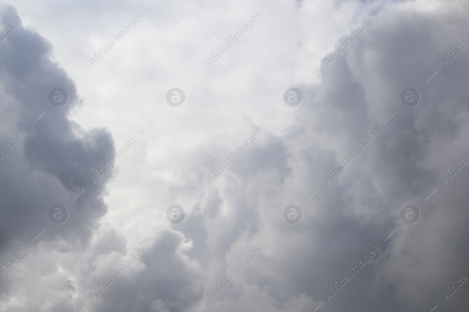 Photo of Sky with heavy rainy clouds on grey day