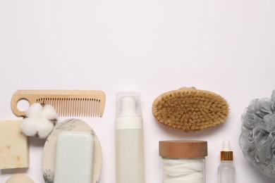 Bath accessories. Flat lay composition with personal care products on white background, space for text