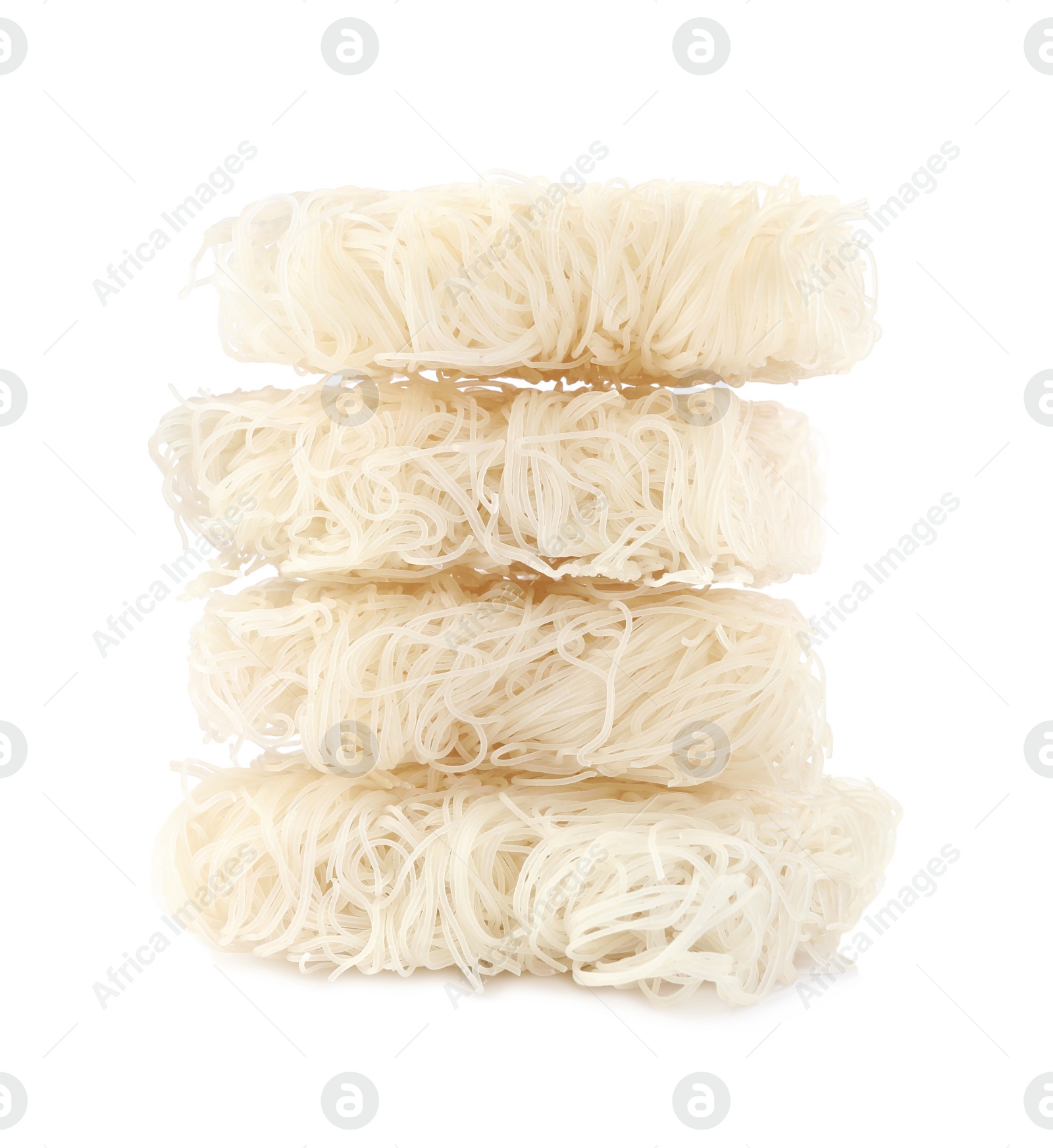 Photo of Bricks of dried rice noodles isolated on white. East Asian cuisine