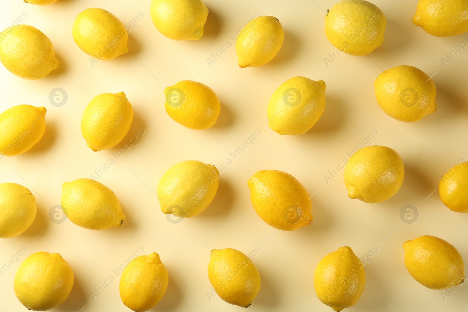 Photo of Flat lay composition with fresh ripe lemons on color background