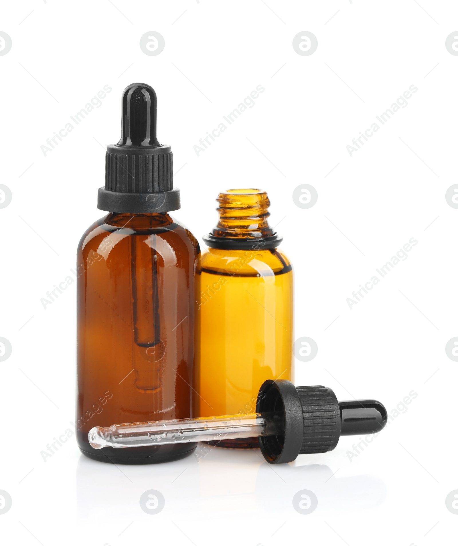 Photo of Glass bottles and pipette with tincture isolated on white