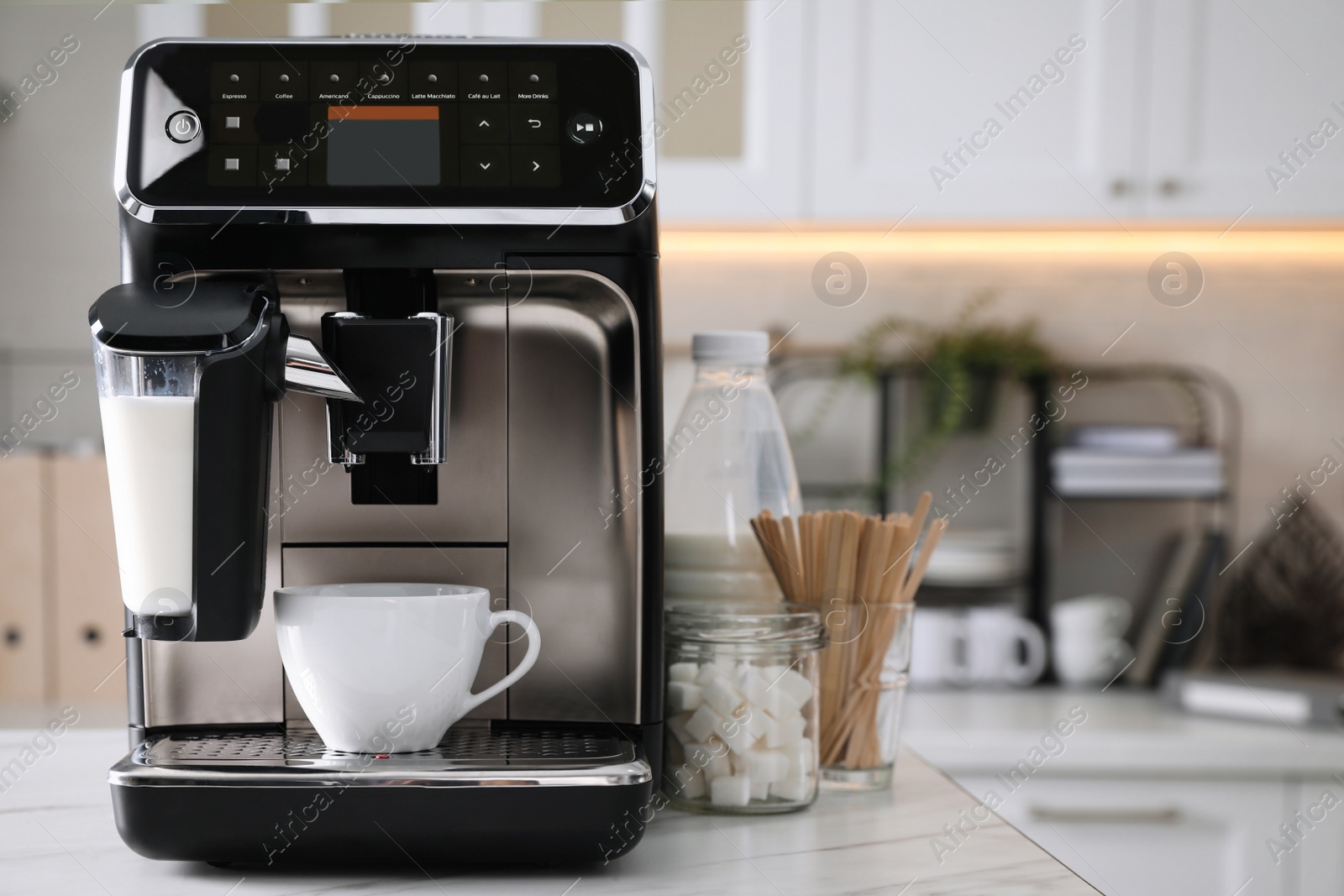 Photo of Modern coffee machine with cup in office kitchen, space for text