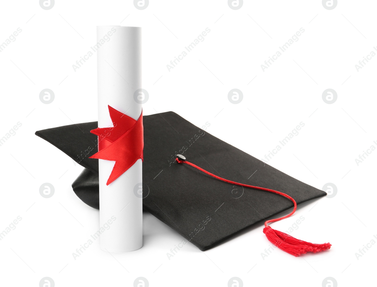 Photo of Graduation hat and diploma on white background