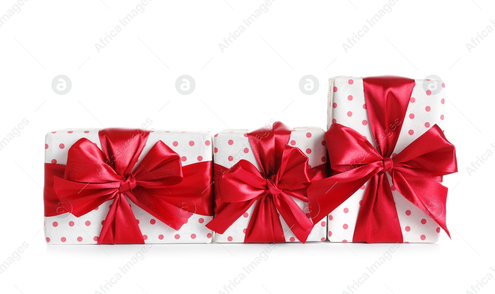 Photo of Beautifully wrapped gift boxes on white background