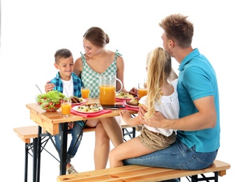 Happy family having picnic at table on white background