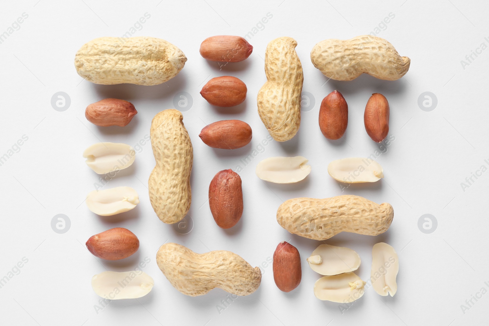 Photo of Fresh peanuts on white background, flat lay