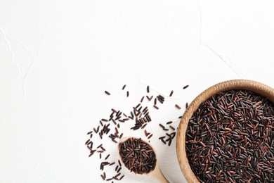 Photo of Flat lay composition with black rice and space for text on white background