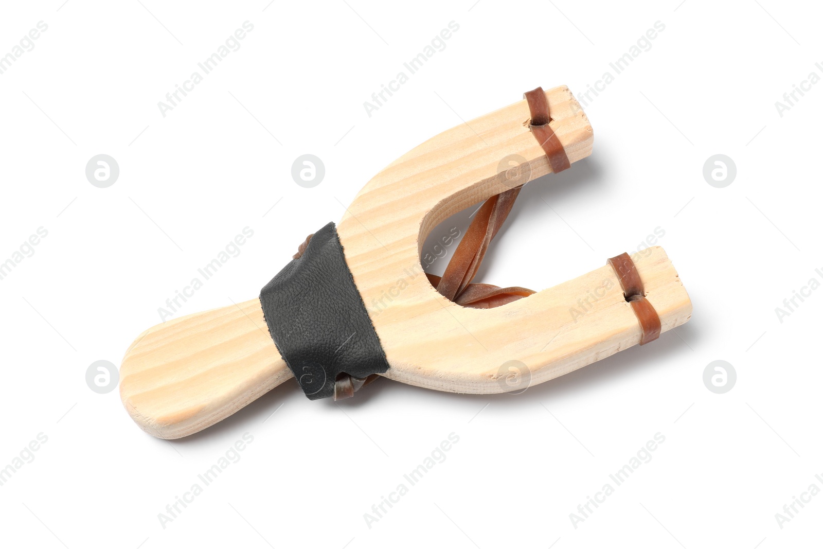 Photo of One wooden slingshot with leather pouch isolated on white