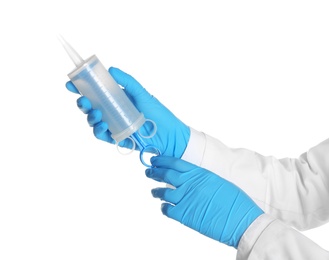Photo of Doctor in medical gloves holding large empty syringe on white background