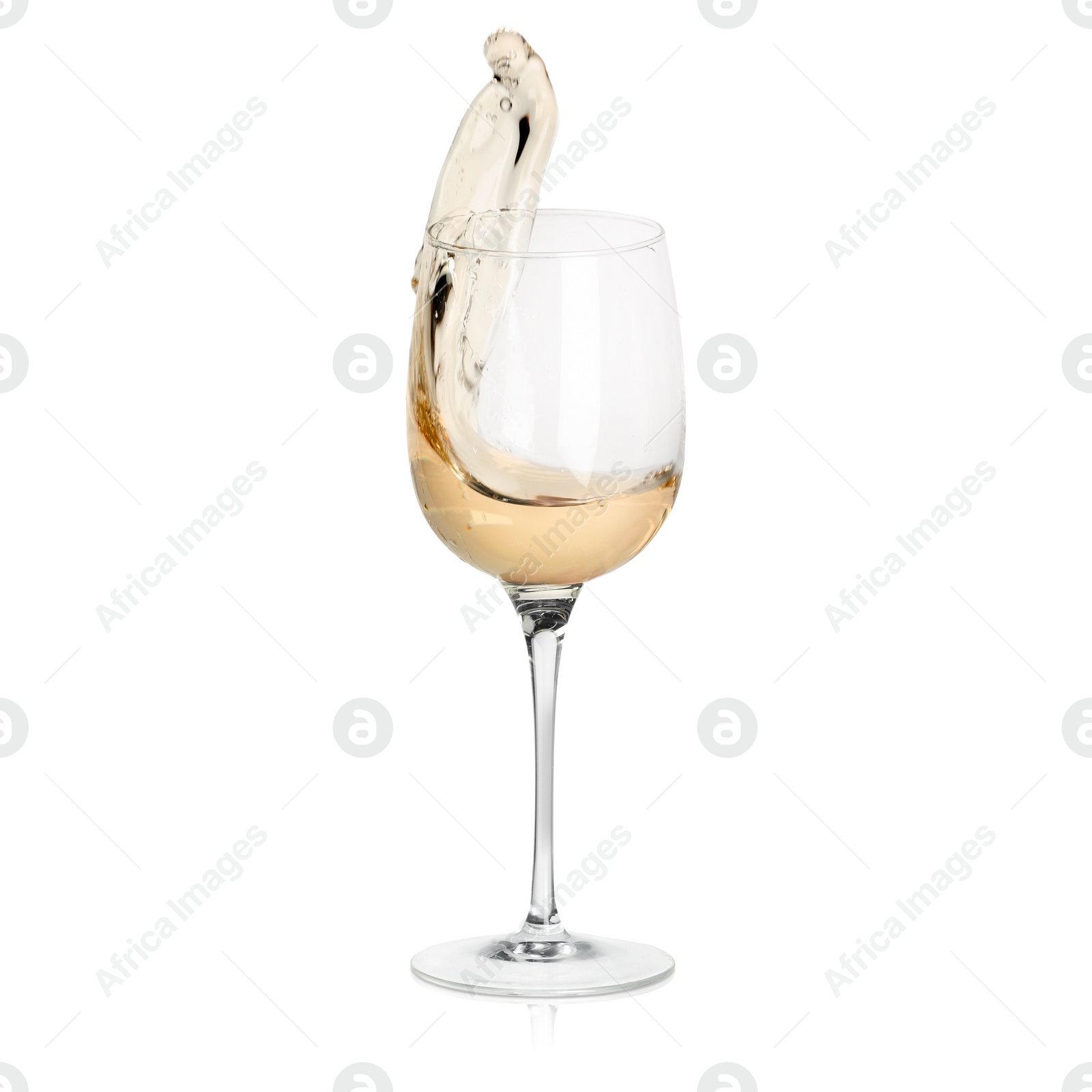 Image of White wine splashing in glass on white background