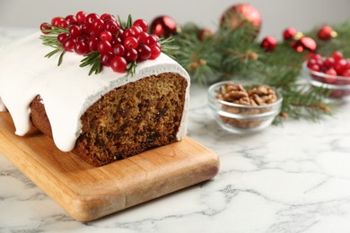 Traditional Christmas cake on white marble table, closeup. Classic recipe