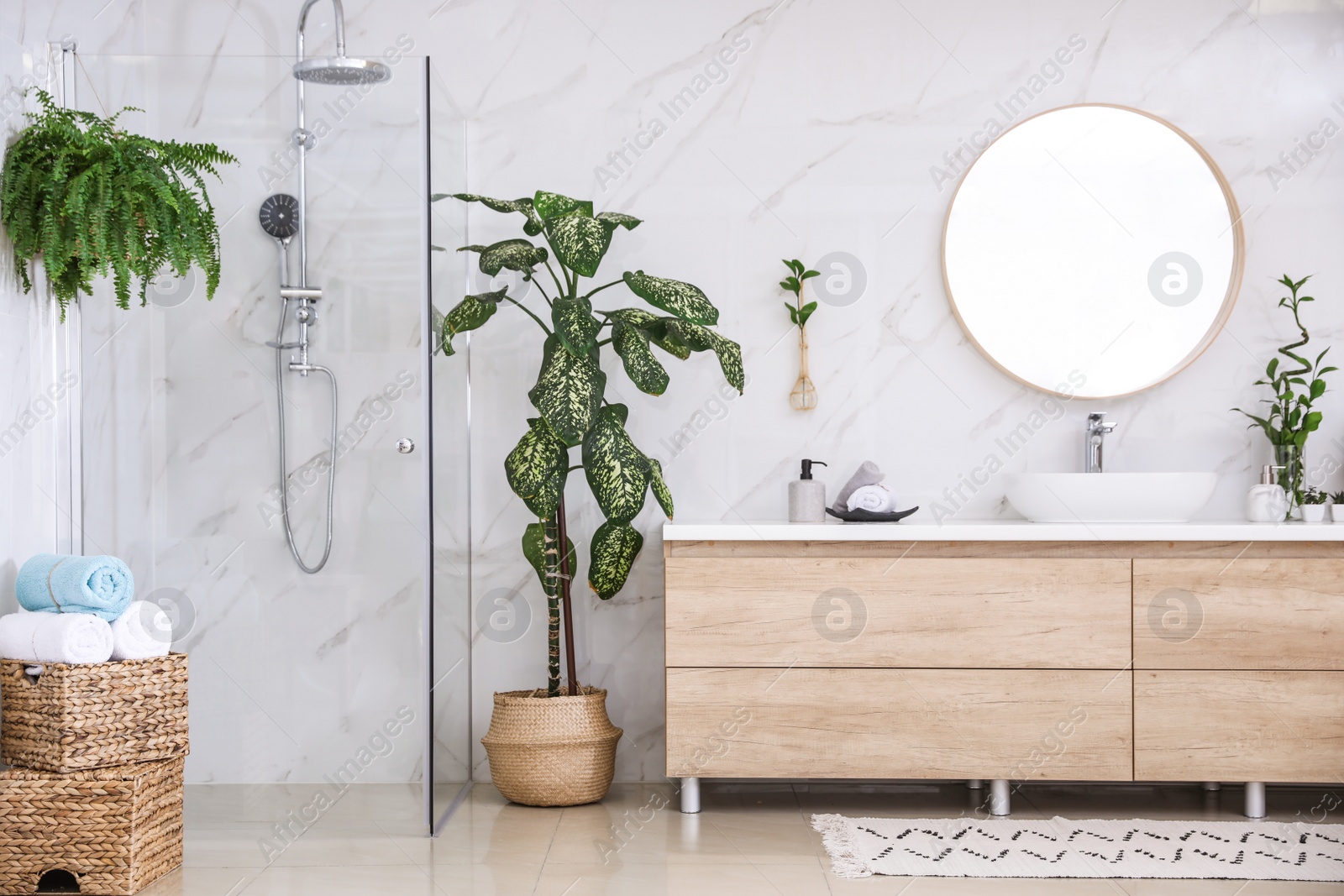 Photo of Green plants in elegant modern bathroom. Interior design