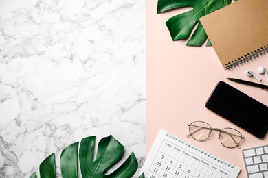 Photo of Flat lay composition with smartphone and stationery on white marble table, space for text