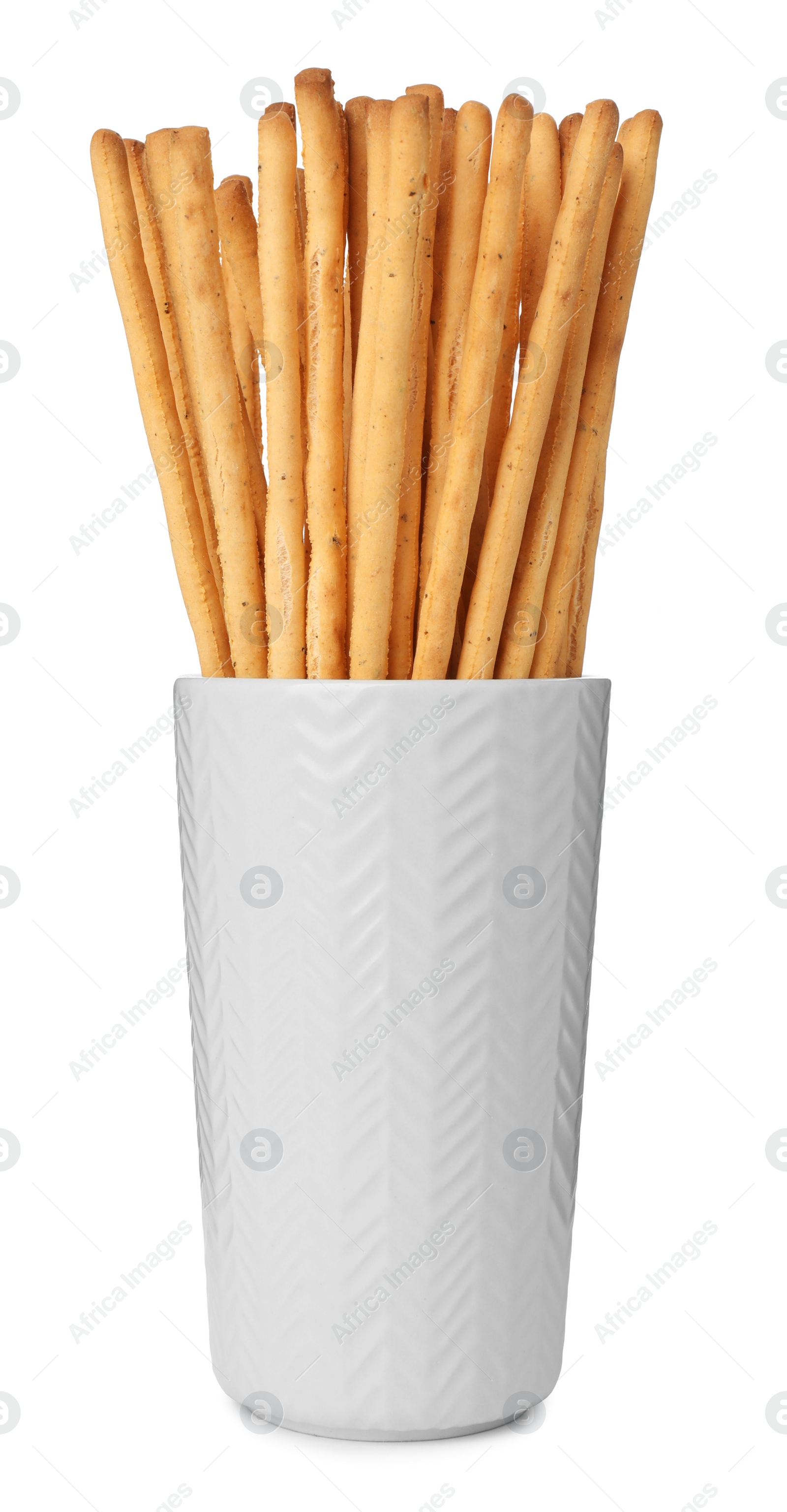 Photo of Delicious grissini sticks in glass on white background